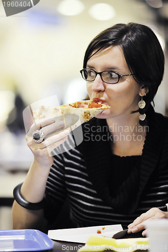 Image of woman eat pizza food at restaurant