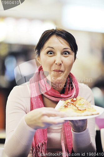 Image of woman eat pizza food at restaurant