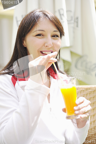 Image of woman drink juice outdoor