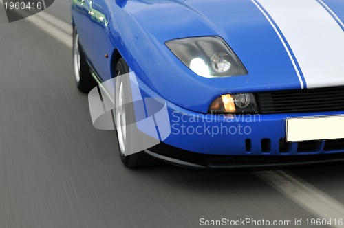 Image of Tuning cars sacing down the highway