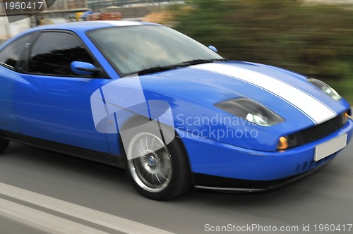 Image of Tuning cars sacing down the highway