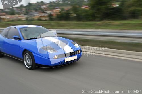 Image of Tuning cars sacing down the highway