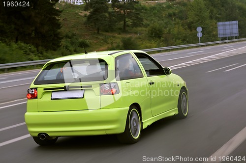 Image of Tuning cars sacing down the highway