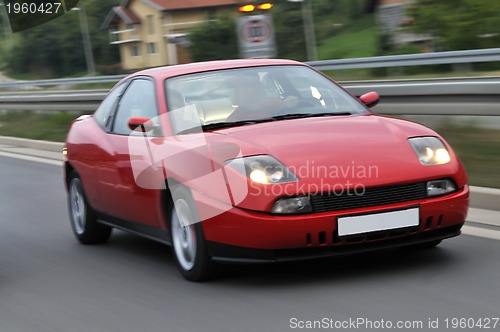 Image of Tuning cars sacing down the highway