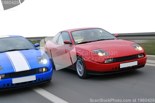 Image of Isolated tuning cars racing on highway 