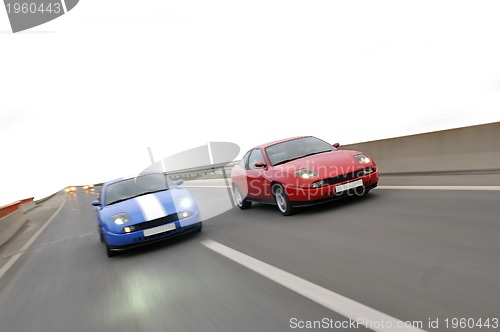 Image of Isolated tuning cars racing on highway 