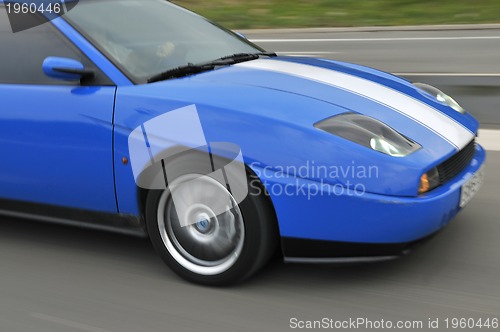 Image of Tuning cars sacing down the highway