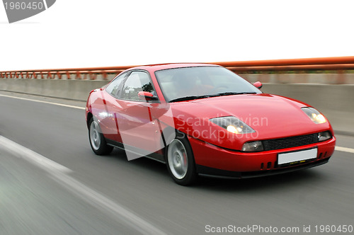 Image of Tuning cars sacing down the highway