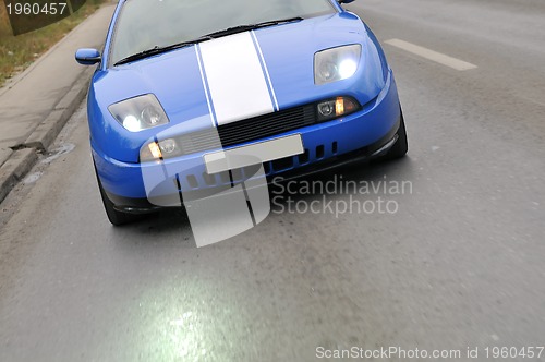 Image of Tuning cars sacing down the highway