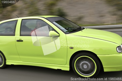 Image of Tuning cars sacing down the highway