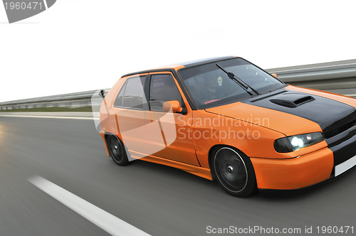 Image of Isolated tuning cars racing on highway 