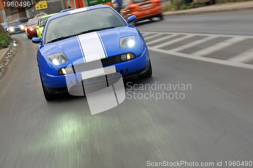 Image of Tuning cars sacing down the highway