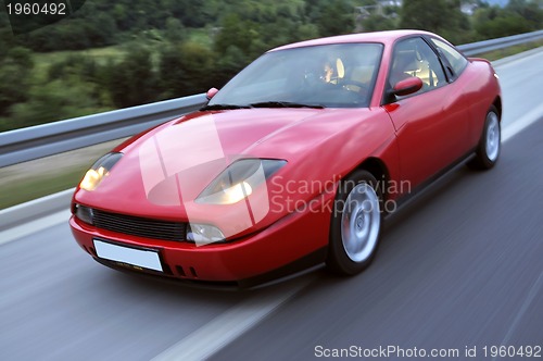 Image of Tuning cars sacing down the highway