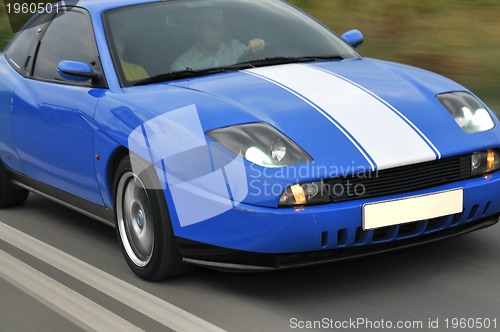 Image of Tuning cars sacing down the highway