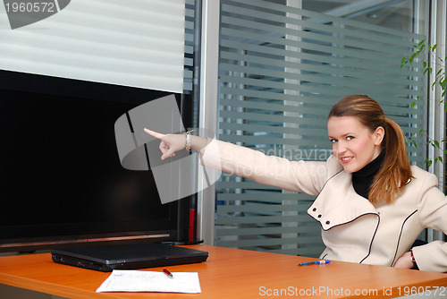 Image of business woman pointing on screen