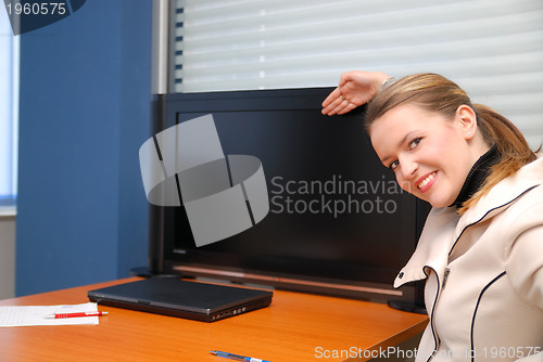 Image of business woman pointing on screen