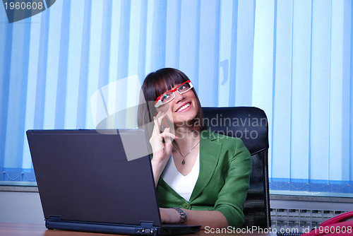 Image of .young businesswoman working on a laptop computer in the office.