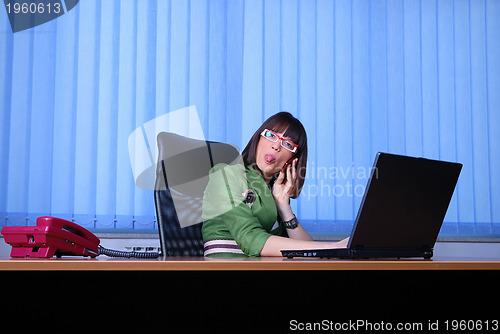 Image of .young businesswoman working on a laptop computer in the office.