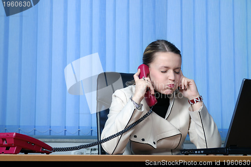 Image of .young businesswoman working on a laptop computer in the office.