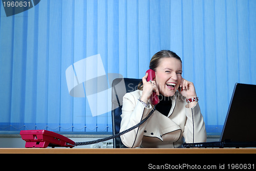 Image of .young businesswoman working on a laptop computer in the office.