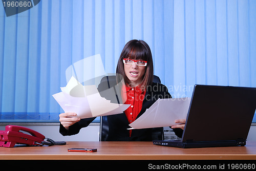 Image of .angry businesswoman holding empty documents | UNFINISHED JOB CO