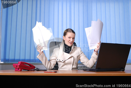 Image of .businesswoman holding empty documents