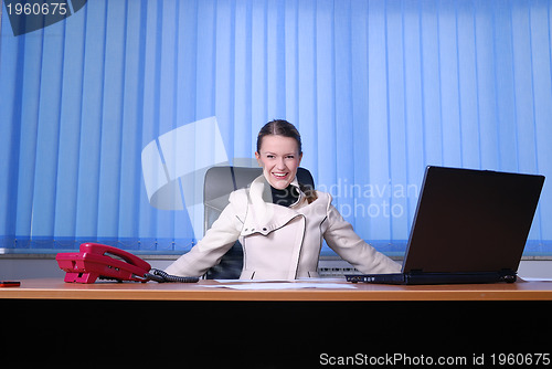 Image of .happy businesswoman throwing papers in air