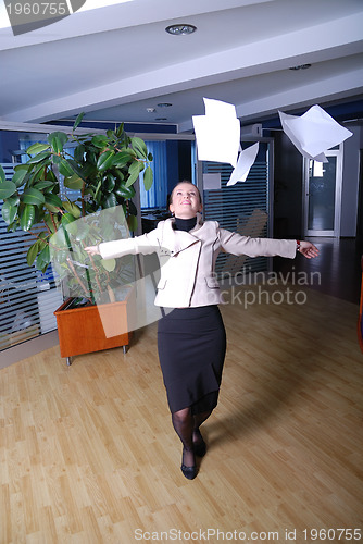 Image of .happy businesswoman throwing documents 