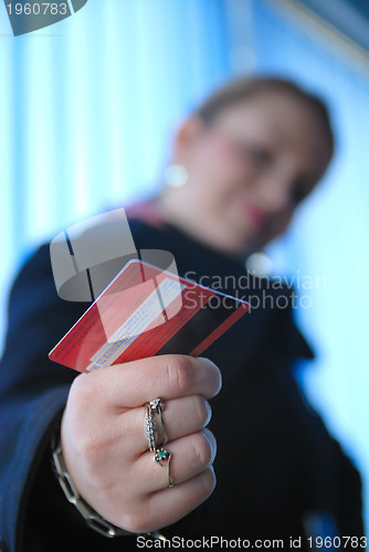 Image of .businesswoman holding credit card