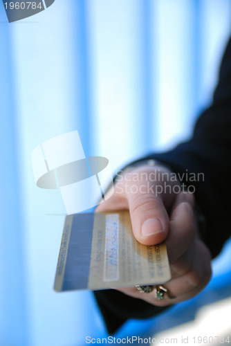 Image of .businesswoman holding credit card