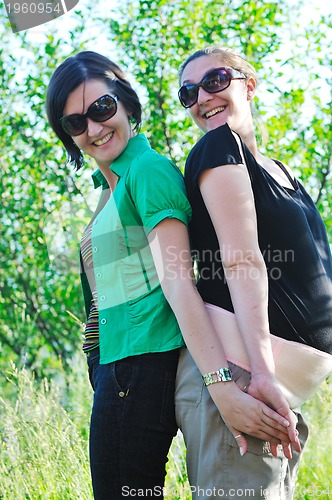 Image of woman pragnant outdoor with friend