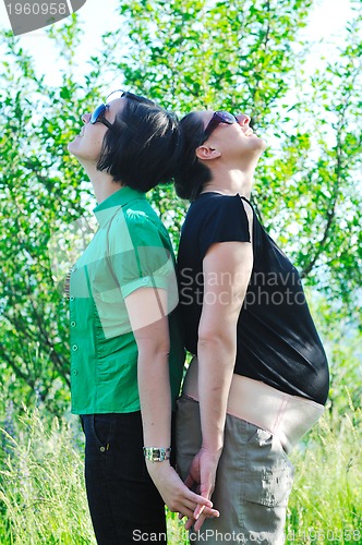 Image of woman pragnant outdoor with friend