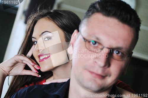 Image of happy young couple indoor