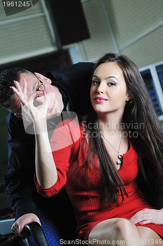 Image of happy young couple indoor