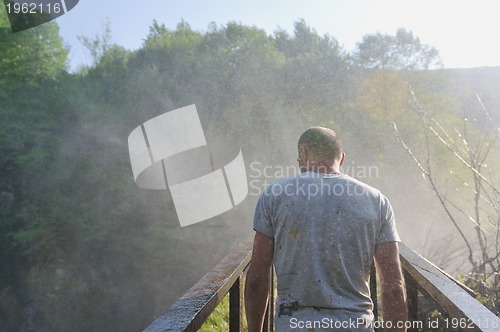 Image of man waterfall