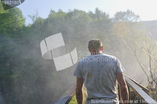 Image of man waterfall