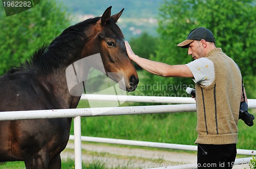 Image of photographer and horse