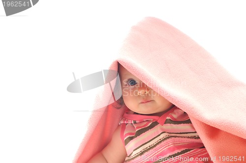 Image of cute baby under  blanket