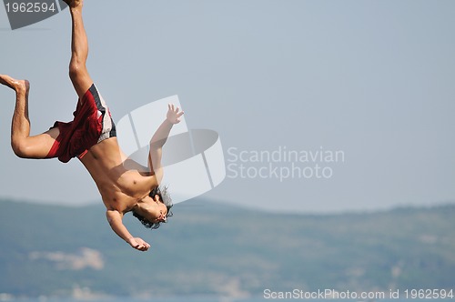 Image of boy jump sea