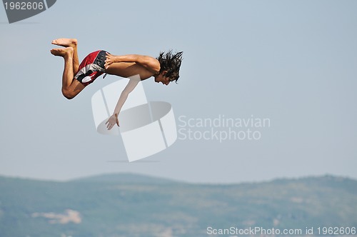 Image of boy jump sea