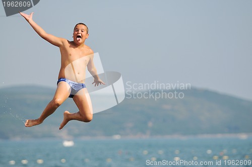 Image of boy jump sea