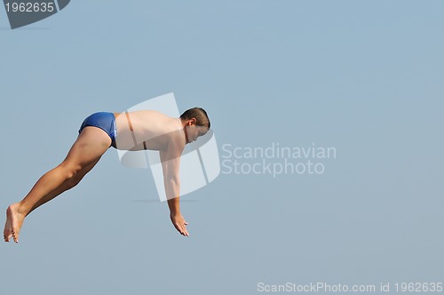 Image of boy jump sea