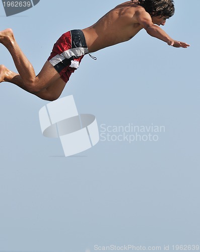 Image of boy jump sea