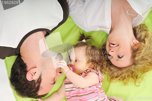Image of happy young family together in studio