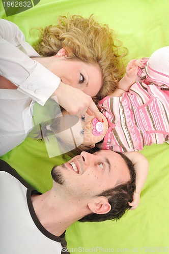 Image of happy young family together in studio