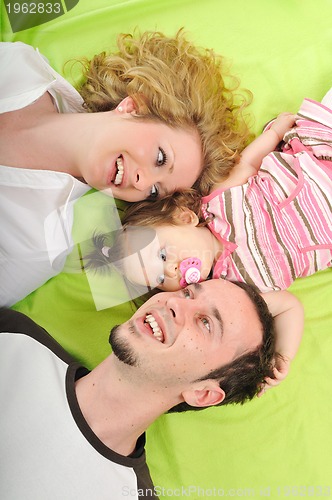 Image of happy young family together in studio