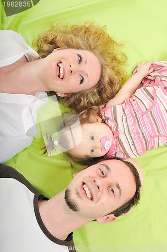 Image of happy young family together in studio