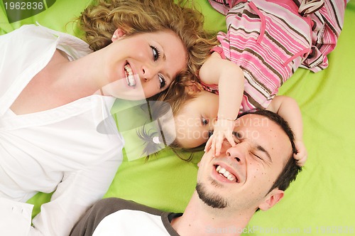 Image of happy young family together in studio