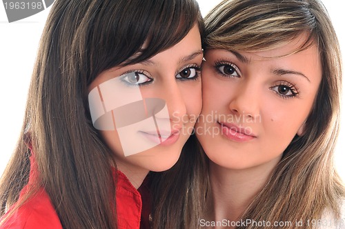 Image of two young girls isolated on white