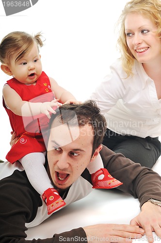 Image of happy young family together in studio